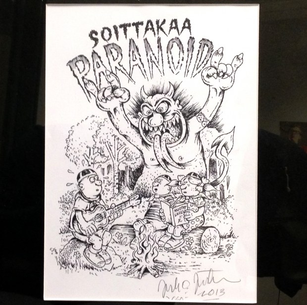 Kansallisen Soittakaa Paranoid! -viikon yleisöpalkinto. Piirtäjä: Juho Juntunen.